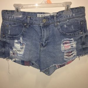 Distressed denim shorts